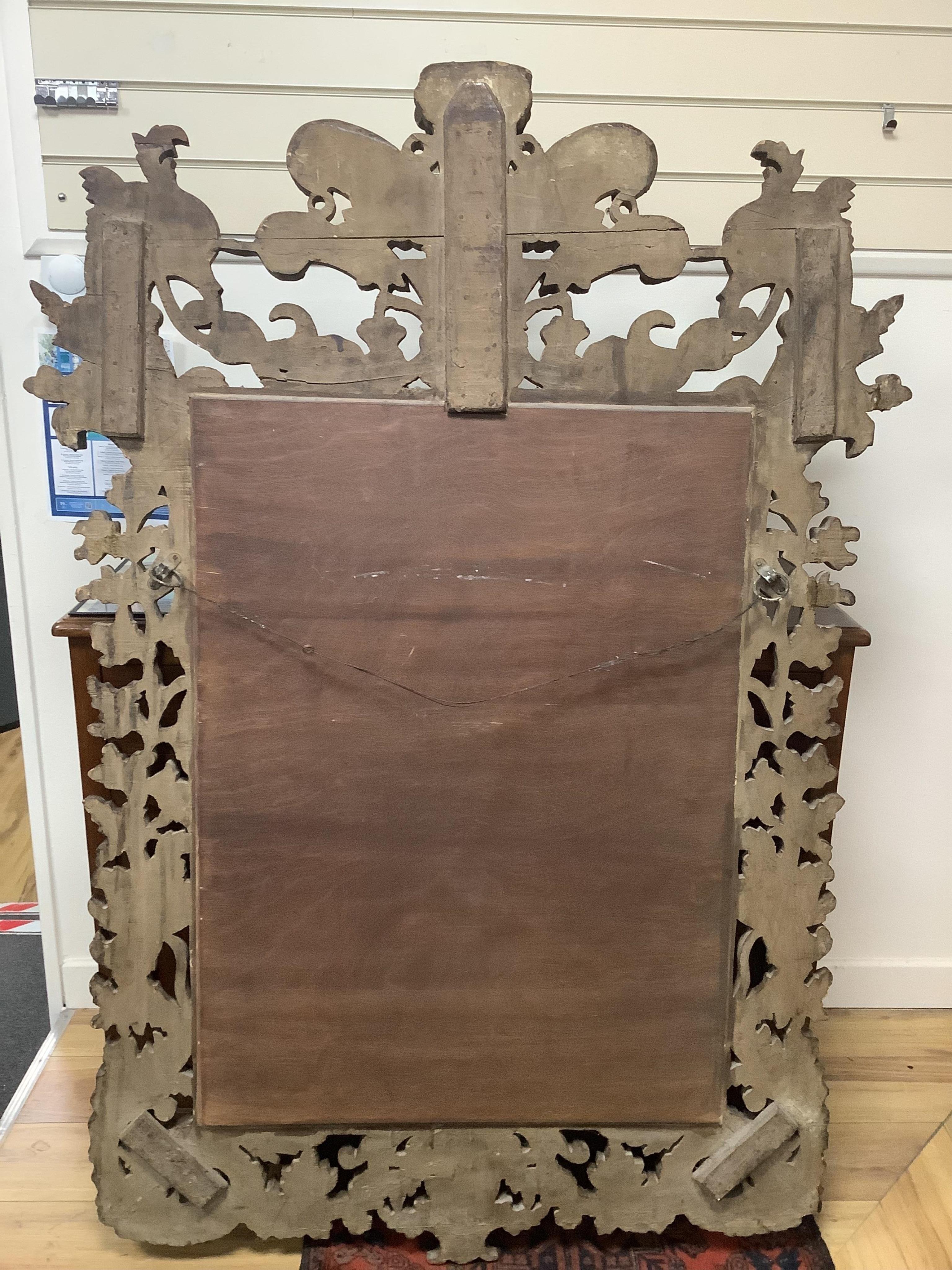 A late 19th century Anglo Indian elaborate carved and giltwood wall mirror, width 109cm, height 155cm. Condition - good